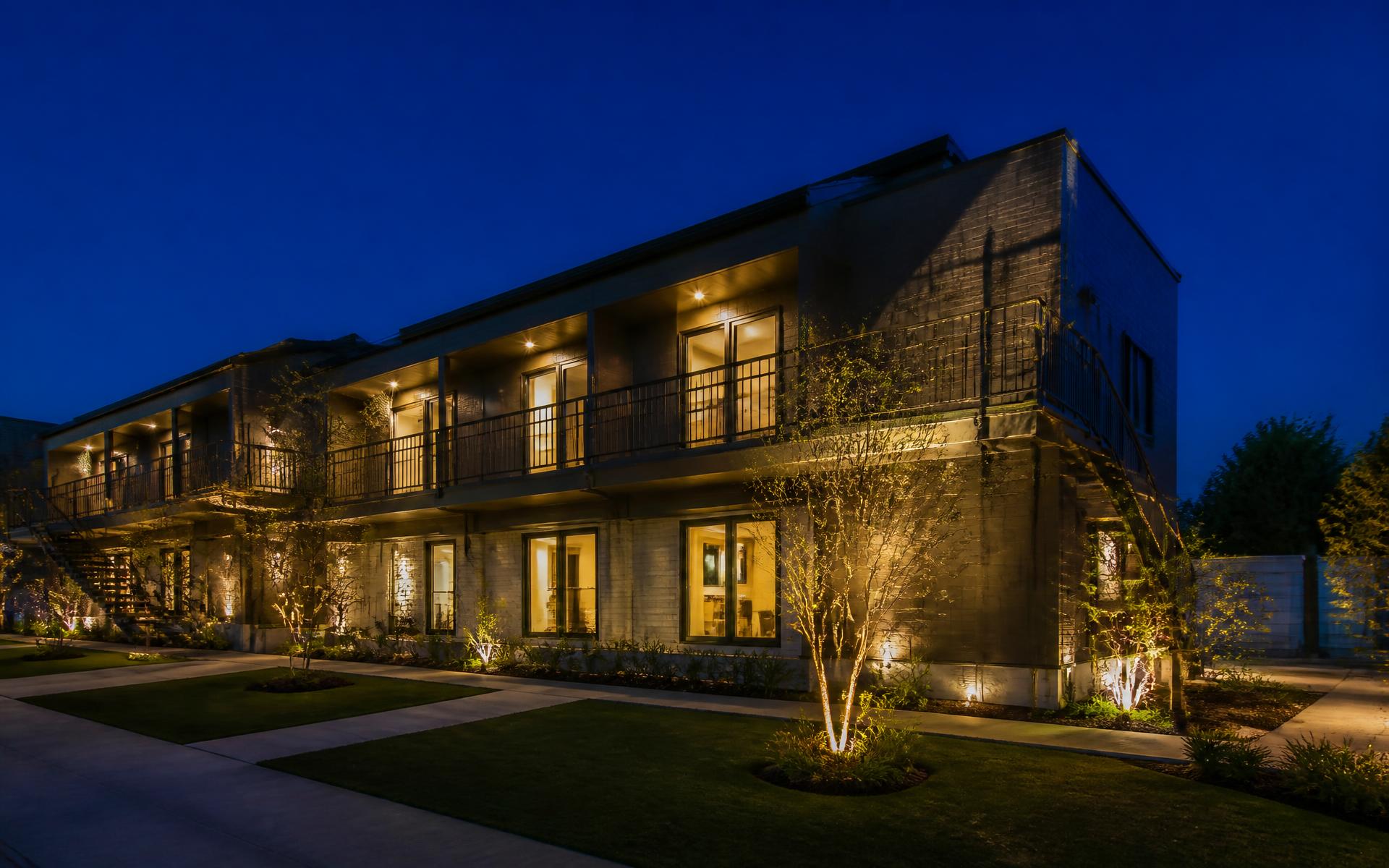 Renovated investment property lit at dusk